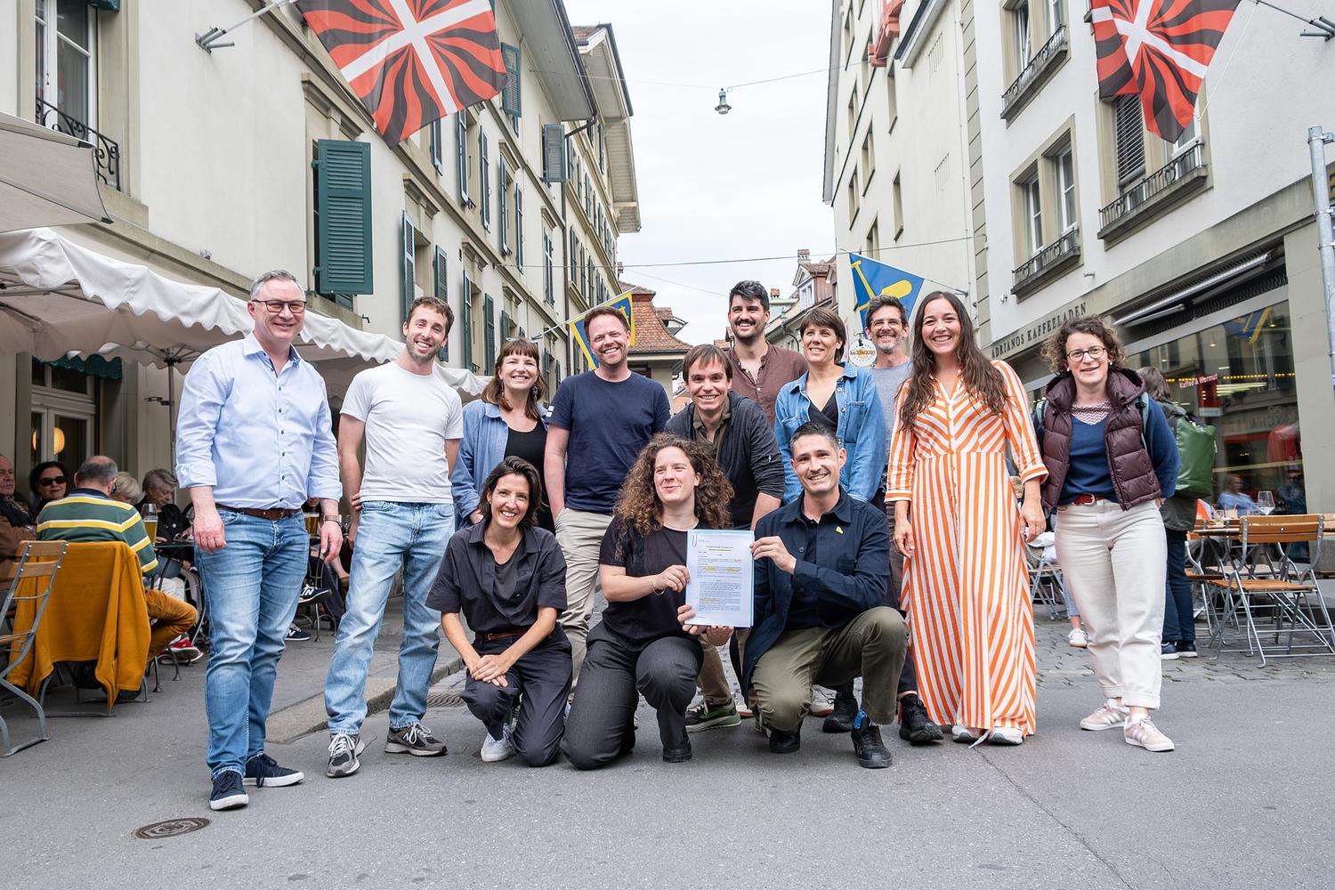 From left to right: Anthony Smith, Nil Homedes, Manon Fantini, Pauline Lavanchy, Basil Dietlicher, Pauline Bessoles, Guillaume Saunier, Lars Kaiser, Sabeth Tödtli, Lucien Langton, Werner Liechtenhan, Muriel Sanchez Solorzano, Chloé Rossier. Also present but not on the photo: Talide Cividino, Antonio da Silva, Cyril Gros, Dominic Moser, Philipp Schweizer Huguenot, Christian Gutknecht, Lukas Rossel and Cécile Schluep