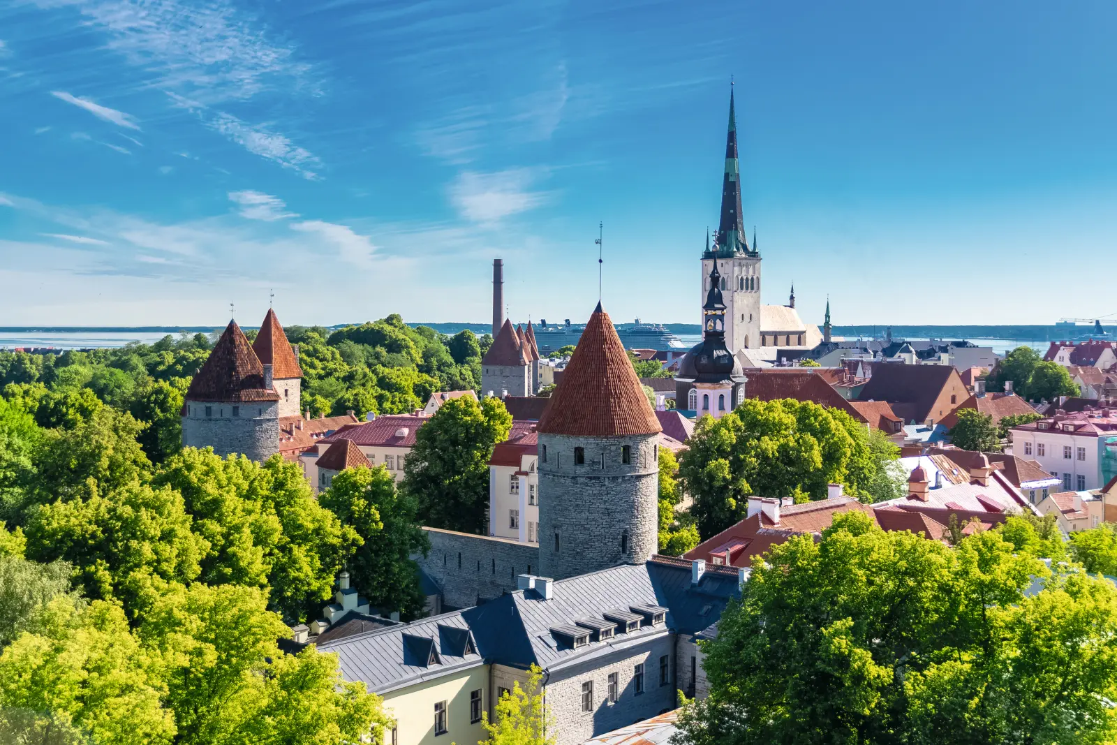 View of Tallinn's Old Town with medieval towers and a church.