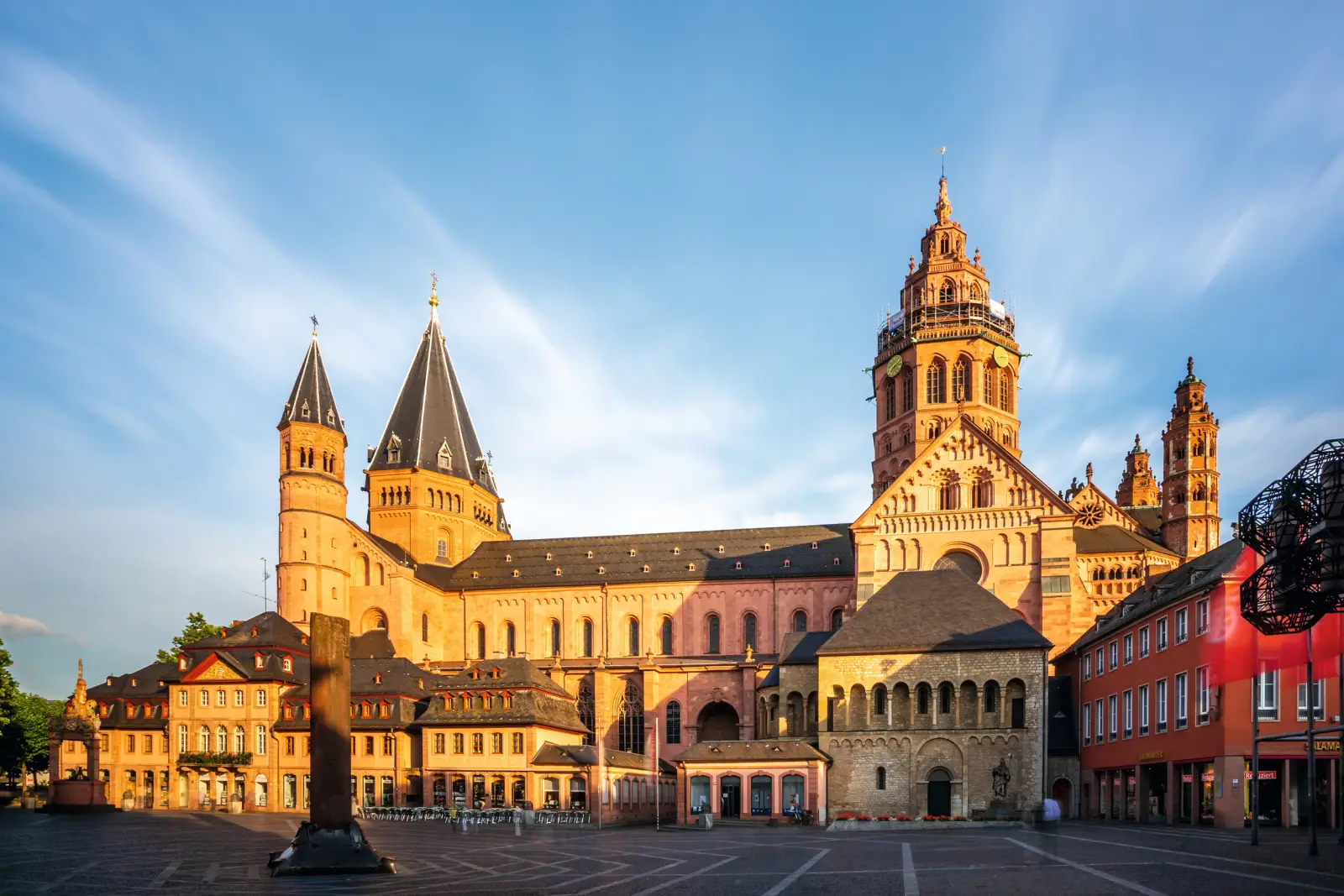 Mainz Cathedral at sunset, front view, blue sky in the background.