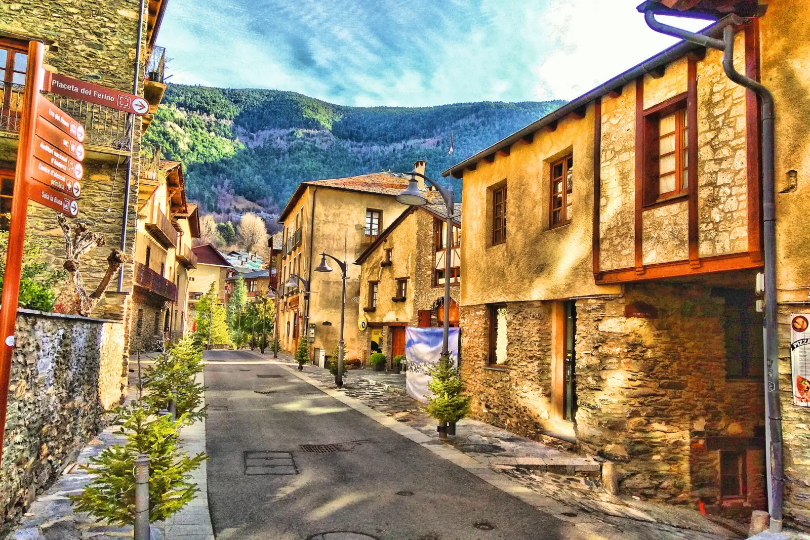 Colourful lane in a mountain village with traditional stone houses.