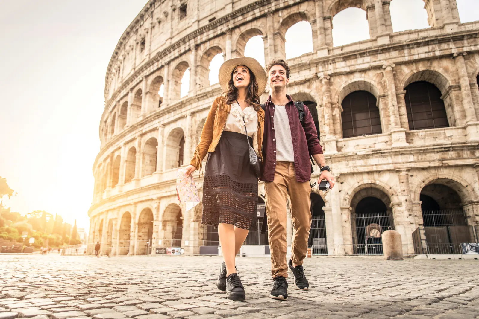 Couple in front of the Colosseum in Rome, Italy.