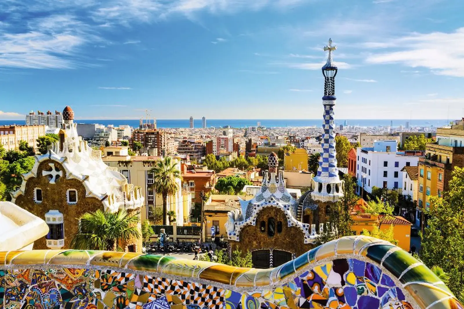 View over Park Güell in Barcelona with the city and sea in the background.