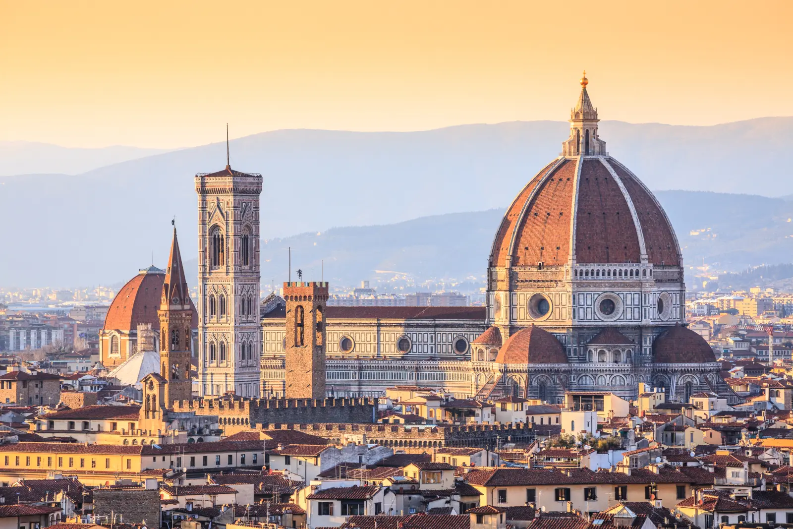 Panorama of Florence with the Cathedral of Santa Maria del Fiore at sunset.