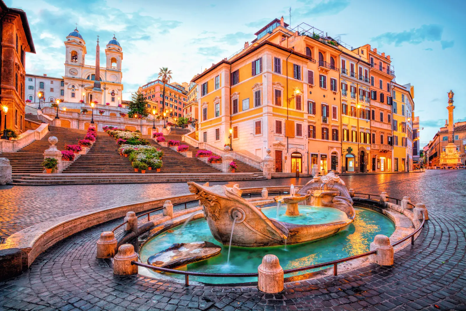 The Spanish Steps and the Fontana della Barcaccia at sunset in Rome.