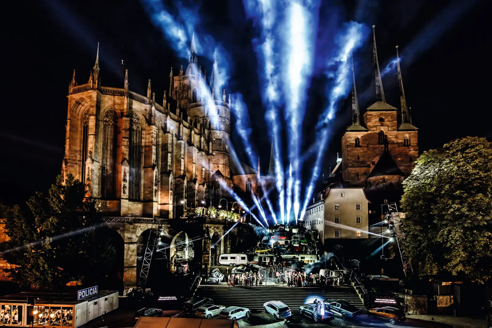 Night shot of the DomStufen Festival with light effects in front of the cathedral in Erfurt.