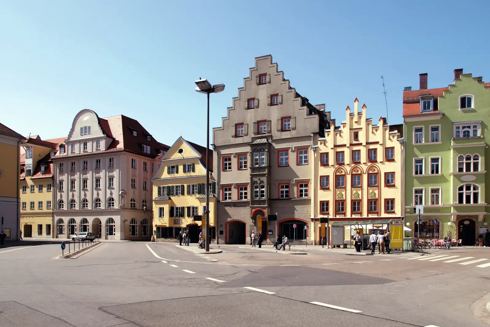 Historic buildings in the Old Town of Regensburg on a sunny day.