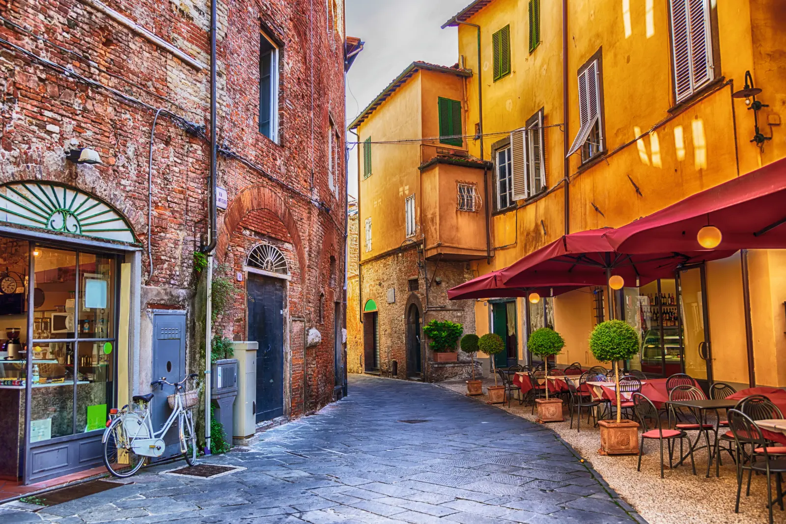 Narrow lane with a café in a historic European old town.