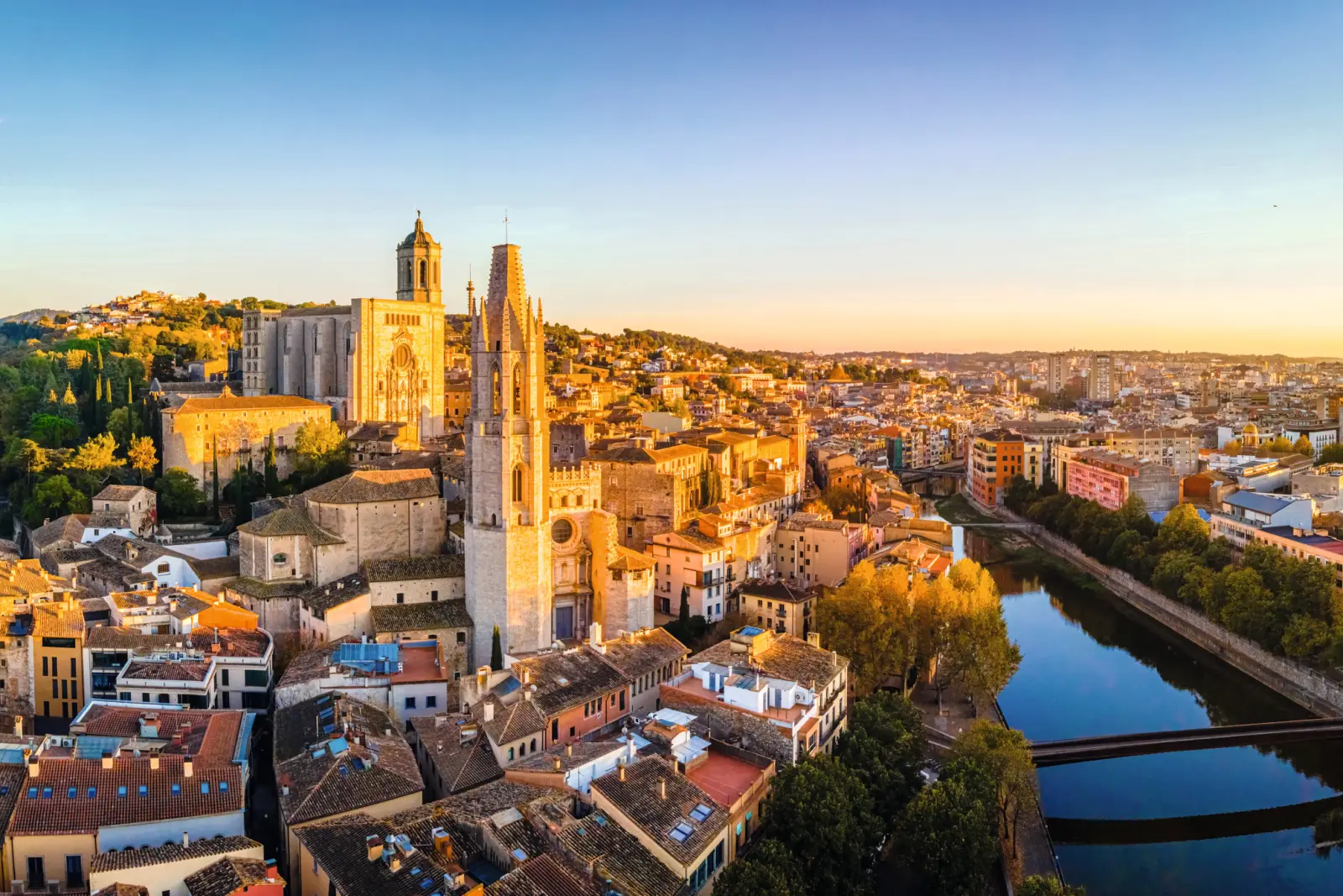 Town view with river and church at sunset