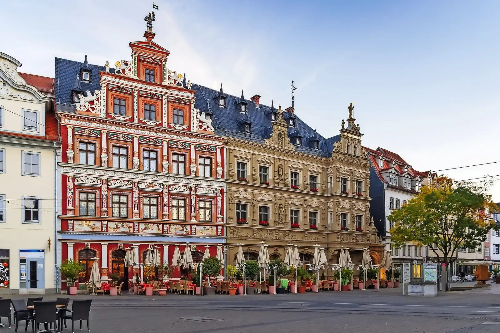 Historic buildings with decorative façades on a town square.